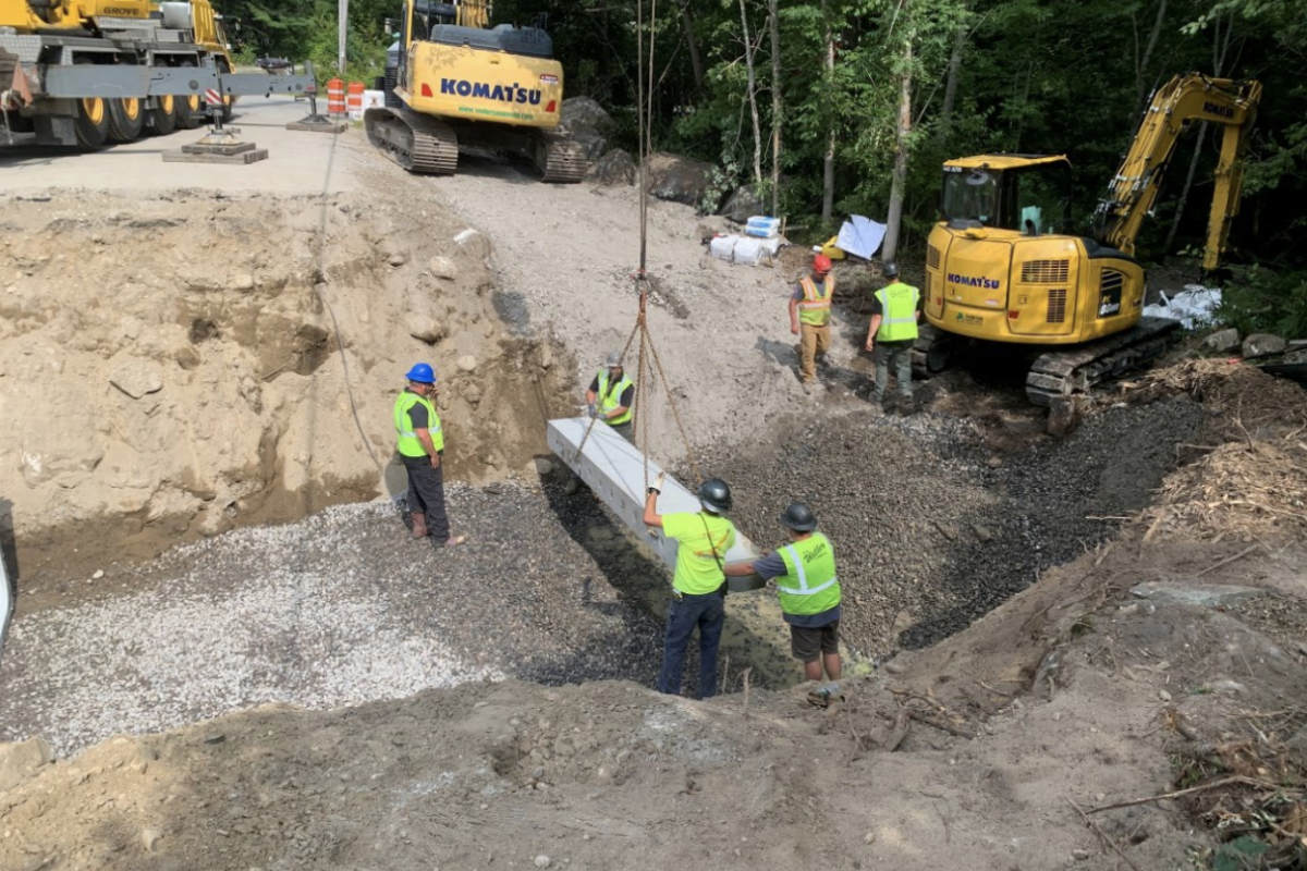 8/7/25 Contractor placing the upstream toe wall (facing northwest)
